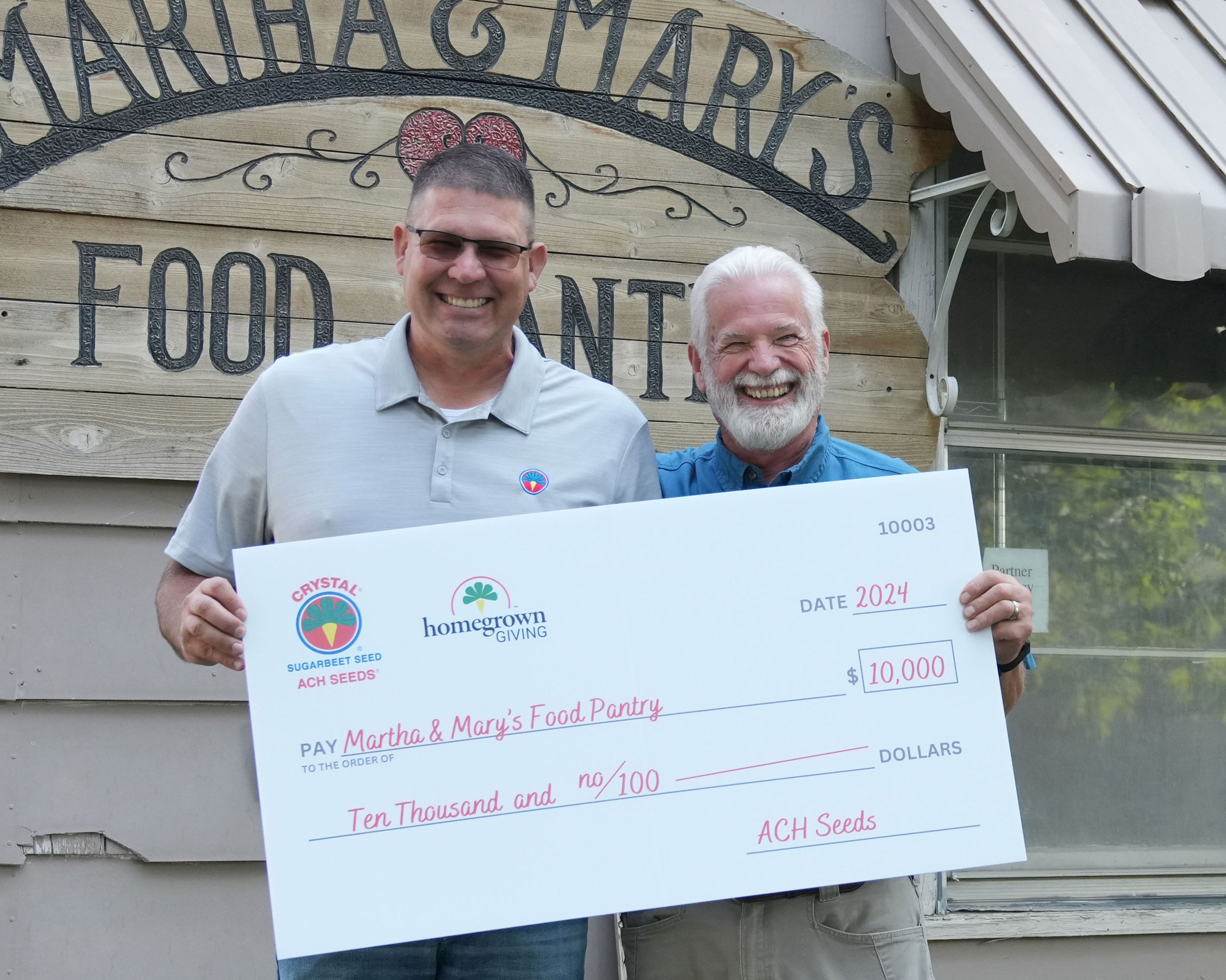 martha and mary's food pantry with their $10,000 check