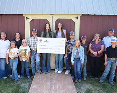 Peg A Way 4H with their $10,000 check